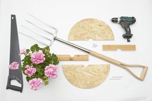 Materials for a DIY upcycled table are a fork, a saw, a cordless drill, nails, screws and pieces of wood.